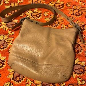 leather crossbody spots front left bottom wear signs on bottom ink stains inside